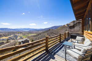Balcony featuring a deck with mountain view