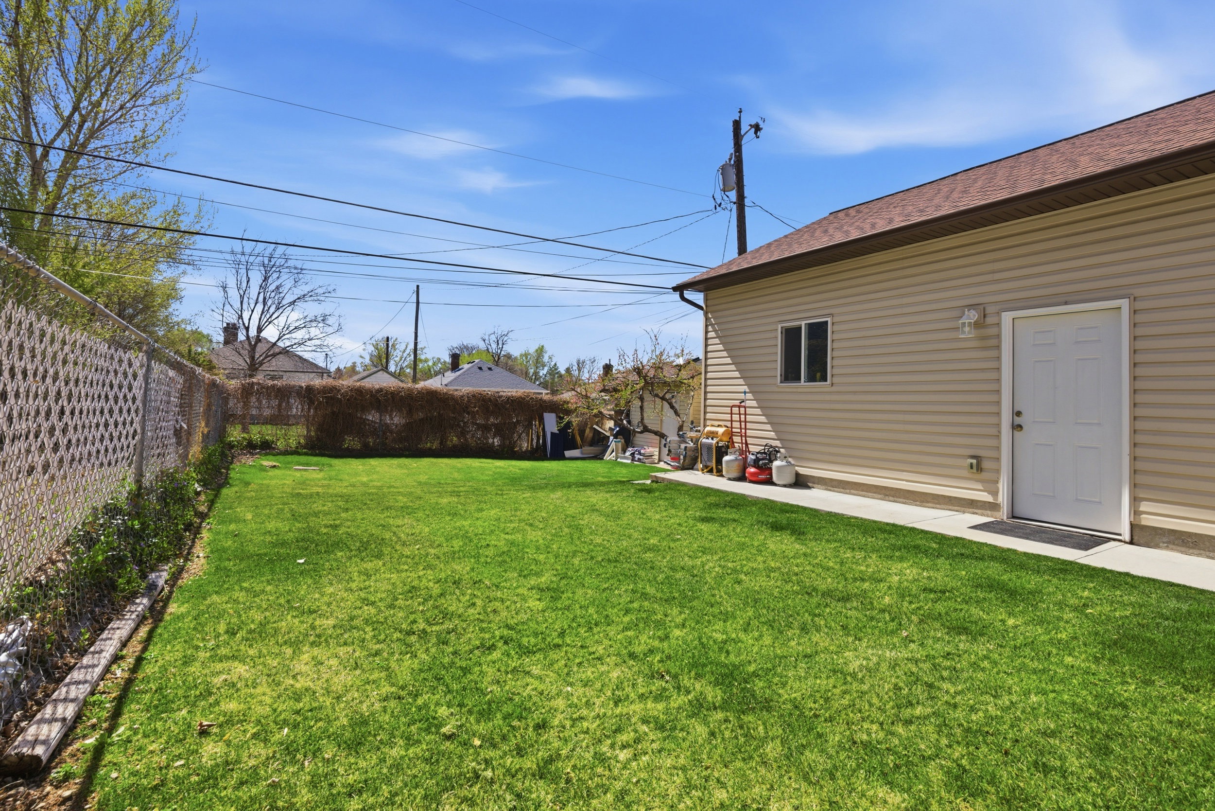 View of fenced backyard