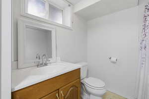 Bathroom with vanity and a shower with shower curtain