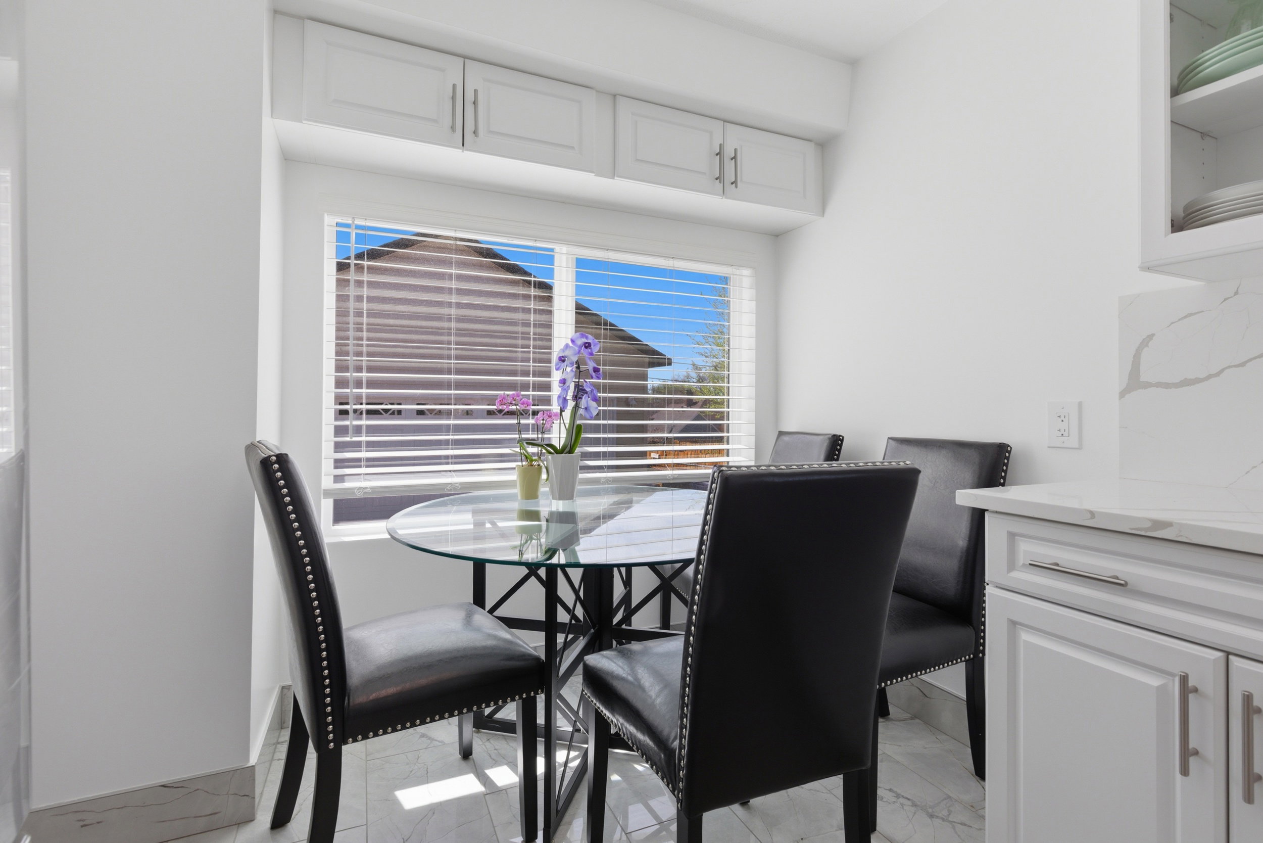 Dining space featuring light marble finish flooring