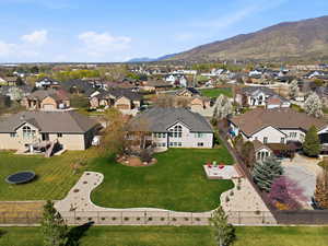 Aerial perspective of suburban area featuring a mountainous background