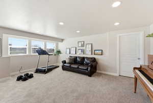 Workout room featuring light colored carpet and recessed lighting