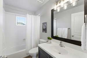 Full bathroom with vanity and shower / bathtub combination with curtain