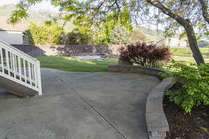 Fenced backyard with a patio and a mountain view