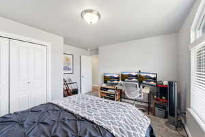 Bedroom featuring a closet and carpet floors