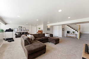 Living room featuring carpet flooring and recessed lighting