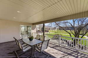 Wooden terrace featuring outdoor dining space
