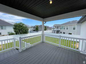 Wooden deck featuring a residential view and a fenced backyard