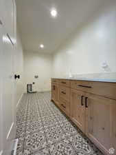 Laundry room with recessed lighting, hookup for a washing machine, and electric dryer hookup