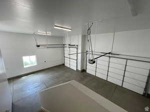 Garage featuring baseboards