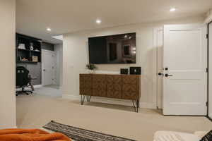 Office featuring recessed lighting and light colored carpet