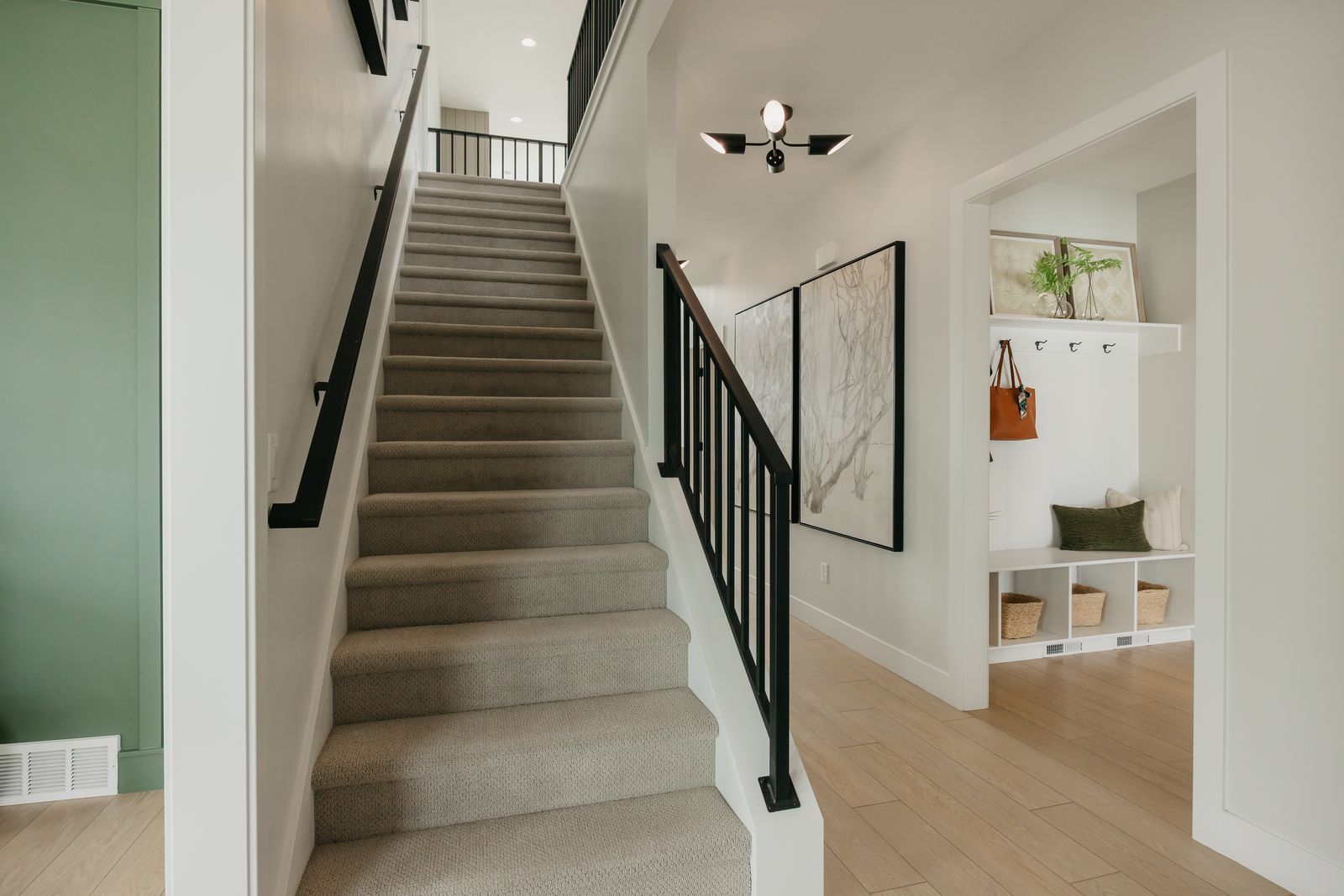 Staircase featuring wood finished floors and baseboards