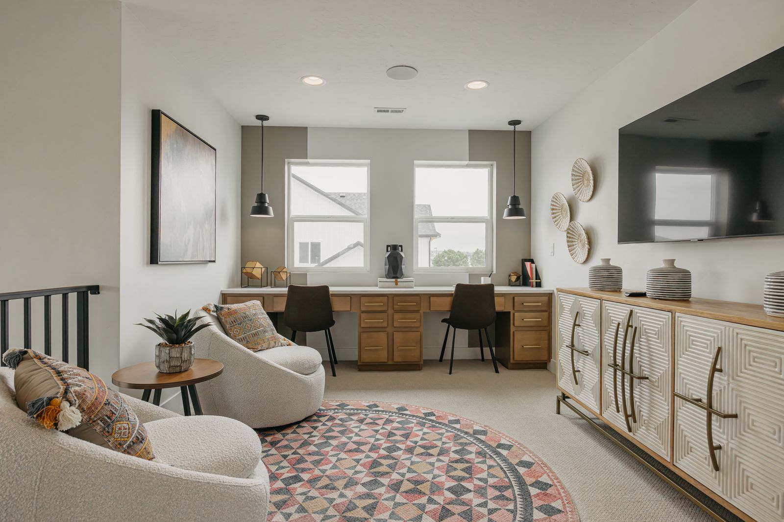 Office space with built in desk, light carpet, and recessed lighting