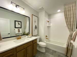 Full bath with vanity, shower / bath combo, and dark floors