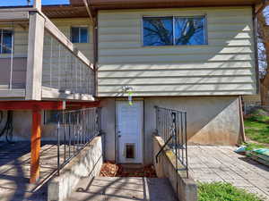 Property entrance with a patio area