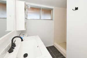 Bathroom with vanity and a stall shower