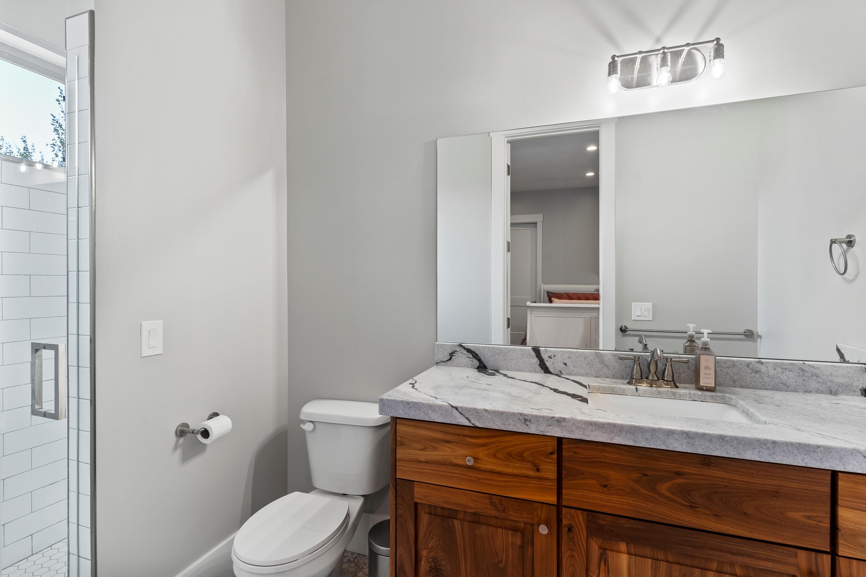 Bathroom with vanity and a shower stall