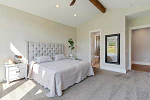 Primary Bedroom featuring light carpet, beam ceiling, recessed lighting, ensuite bathroom, and a ceiling fan