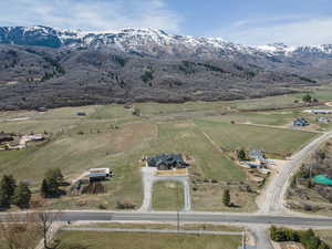 Aerial view of property's location featuring mountains and rural landscape