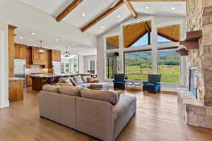 Kitchen with gas range, custom walnut wood cabinets, granite and large island. Amazing mountain views.