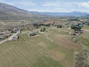 Aerial view of property's location featuring mountains and rural landscape