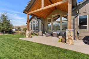 Covered porch with custom timber beams. Watching the sunsets and summers under the shade.