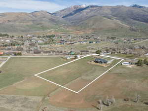 Aerial view of property and surrounding area with property boundaries highlighted and rural landscape