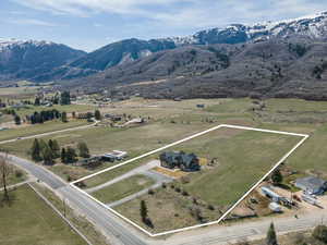 View of rural area featuring property parcel outlined and a mountainous background