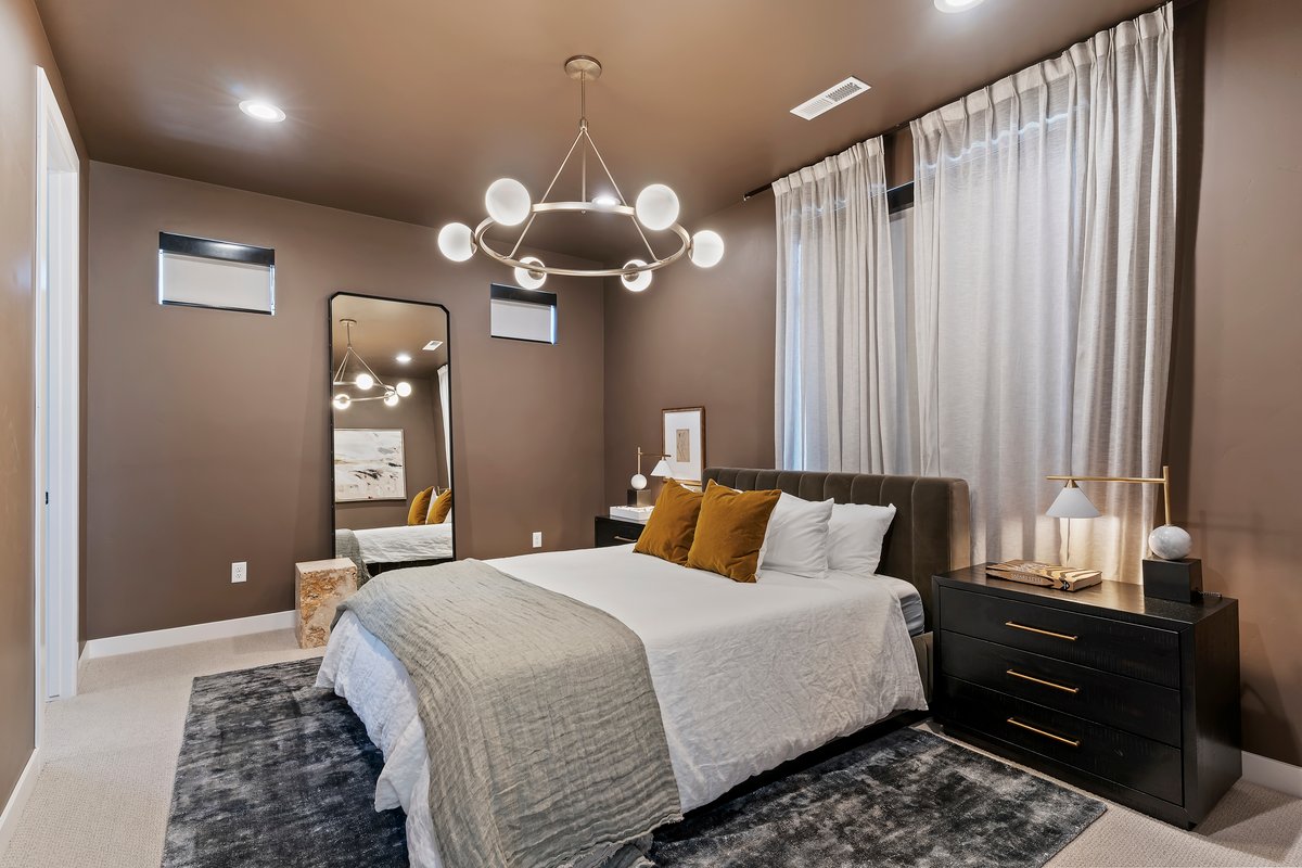Bedroom featuring carpet floors and a chandelier