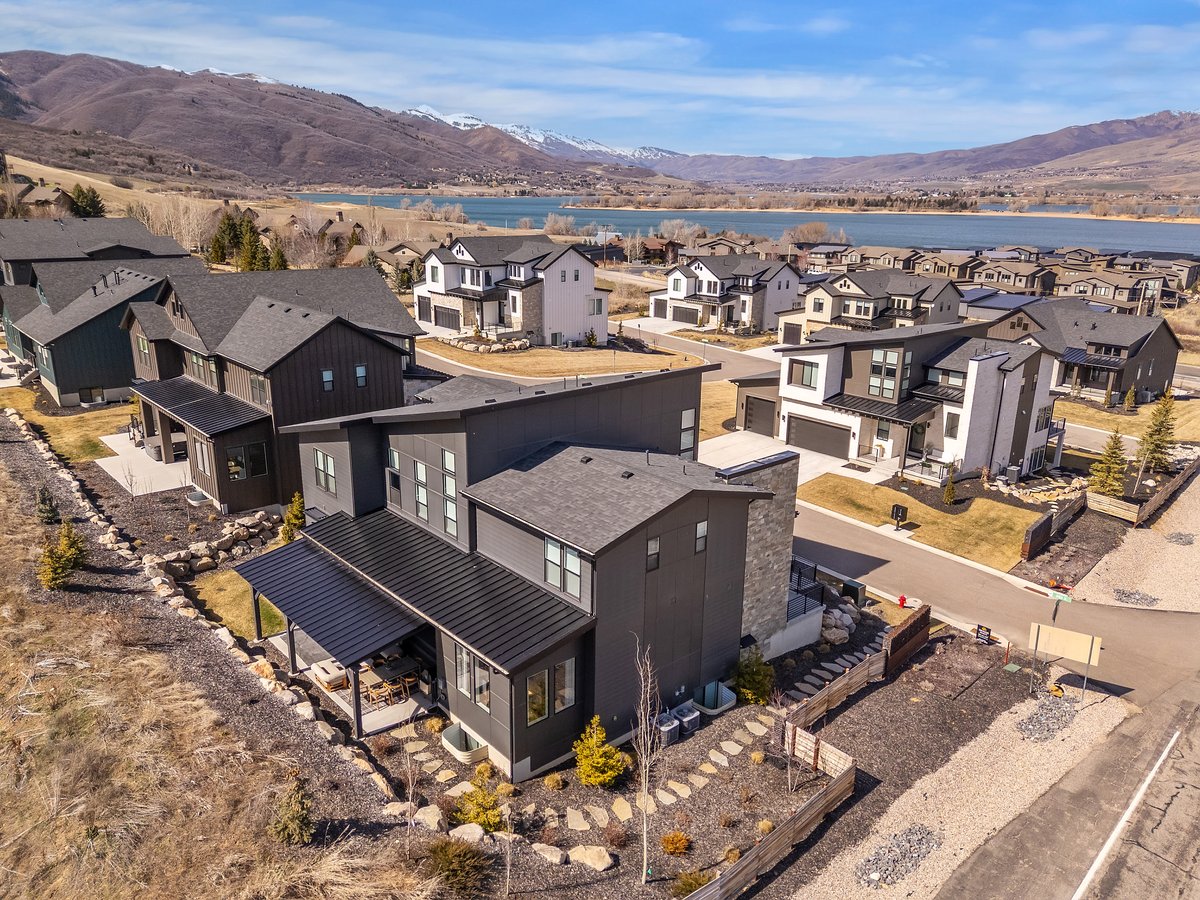 Aerial perspective of suburban area with a mountain backdrop