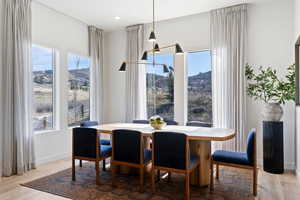 Dining space featuring a mountain view and light wood-type flooring