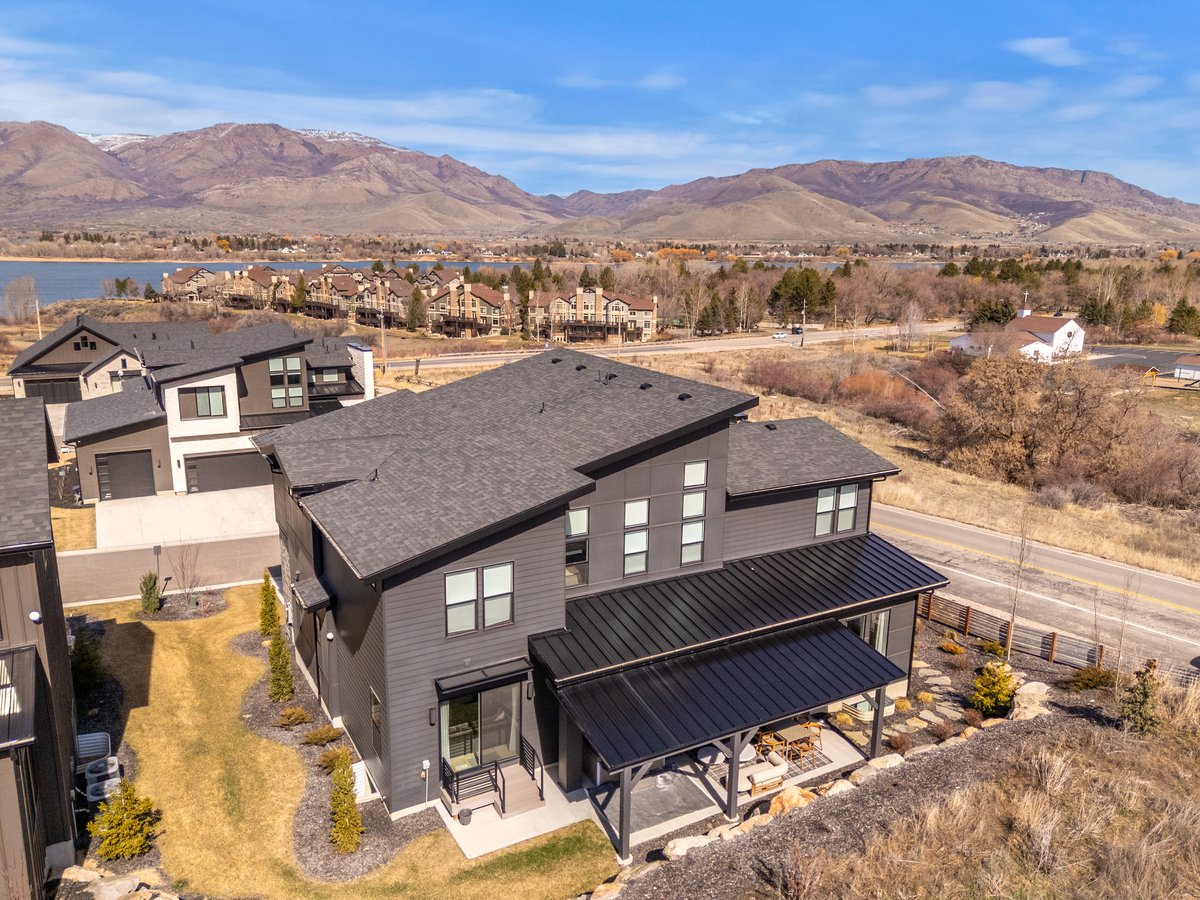 Aerial perspective of suburban area featuring a mountainous background