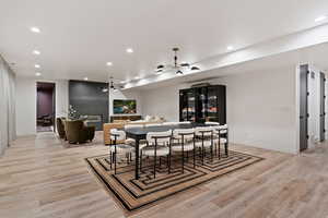 Dining area featuring light wood-style floors and recessed lighting
