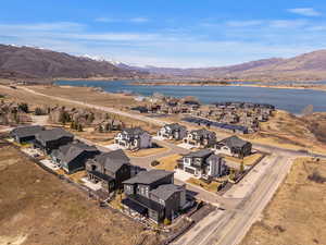 Aerial perspective of suburban area featuring a water and mountain view