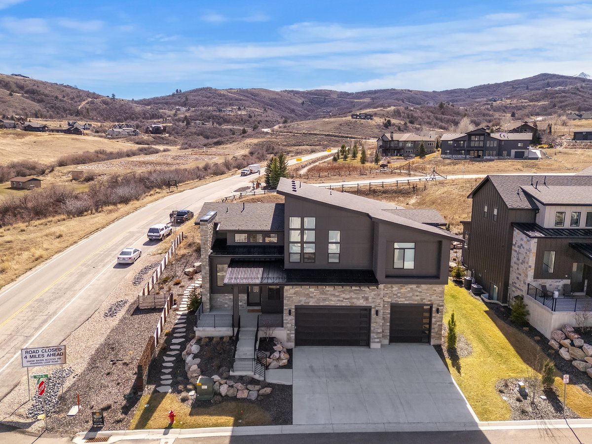 Aerial view of residential area featuring a mountainous background