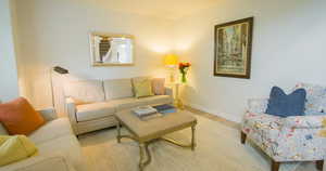 Living room with wood finished floors and baseboards