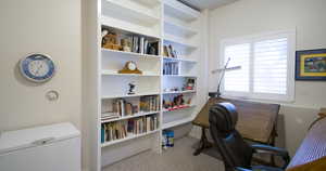 Office featuring light carpet