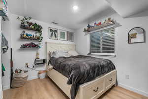 Bedroom with light wood-style floors