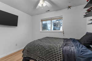 Bedroom featuring light wood-type flooring and ceiling fan