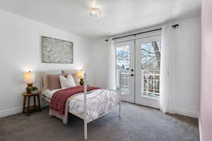 Bedroom featuring french doors, carpet, and access to exterior