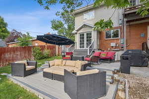 View of patio / terrace featuring an outdoor lounge area, a deck, area for grilling, and entry steps
