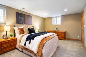 Bedroom featuring light colored carpet and recessed lighting