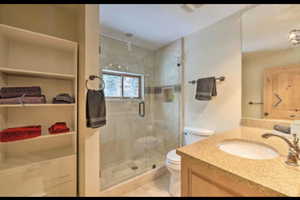 Full bath with vanity and a stall shower