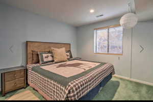 Bedroom featuring light colored carpet and recessed lighting