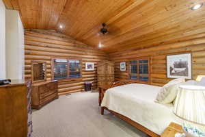 Bedroom featuring recessed lighting, log walls, carpet flooring, and a vaulted wooden ceiling