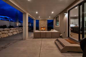 Covered back patio features recessed lighting, gas fireplace, eve outlets and outlets on the north and south pillar.