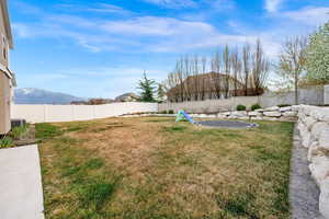 Fully fenced yard with built in trampoline
