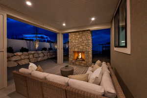 Covered back patio features recessed lighting, gas fireplace, eve outlets and outlets on the north and south pillar.