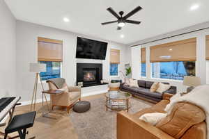 Cozy living room with gas fireplace and lots of natural light.