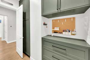 Drop center with charging drawer below that houses hidden plug ins for easy charging and no hanging cords